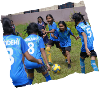Girls playing football at school